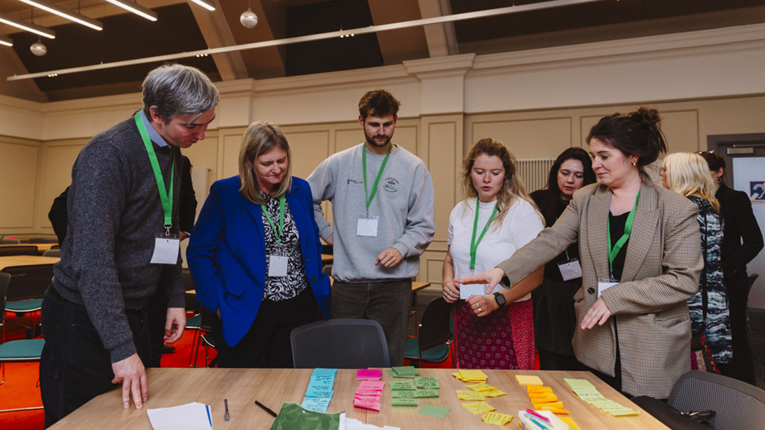 Participants at the Coast-R Launch Event gather around a table
