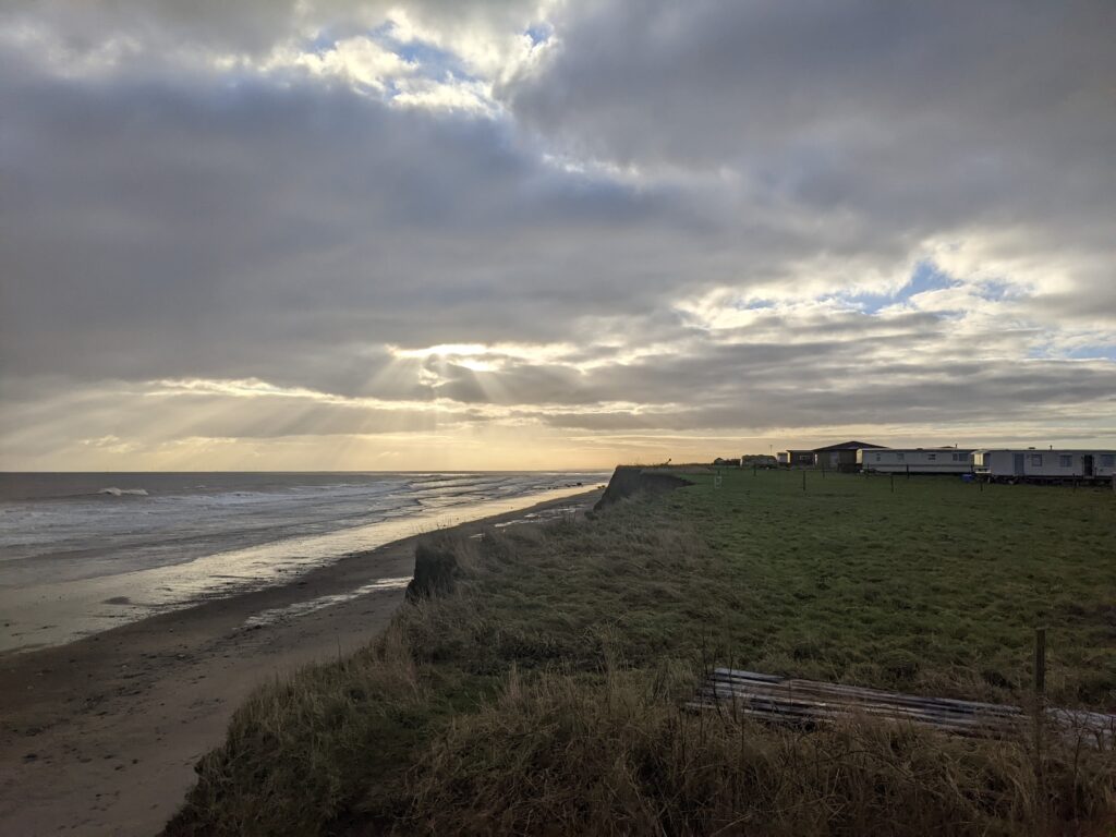 Caravan park overlooking a beach with eroding cliffs on the East Coast of Yorkshire