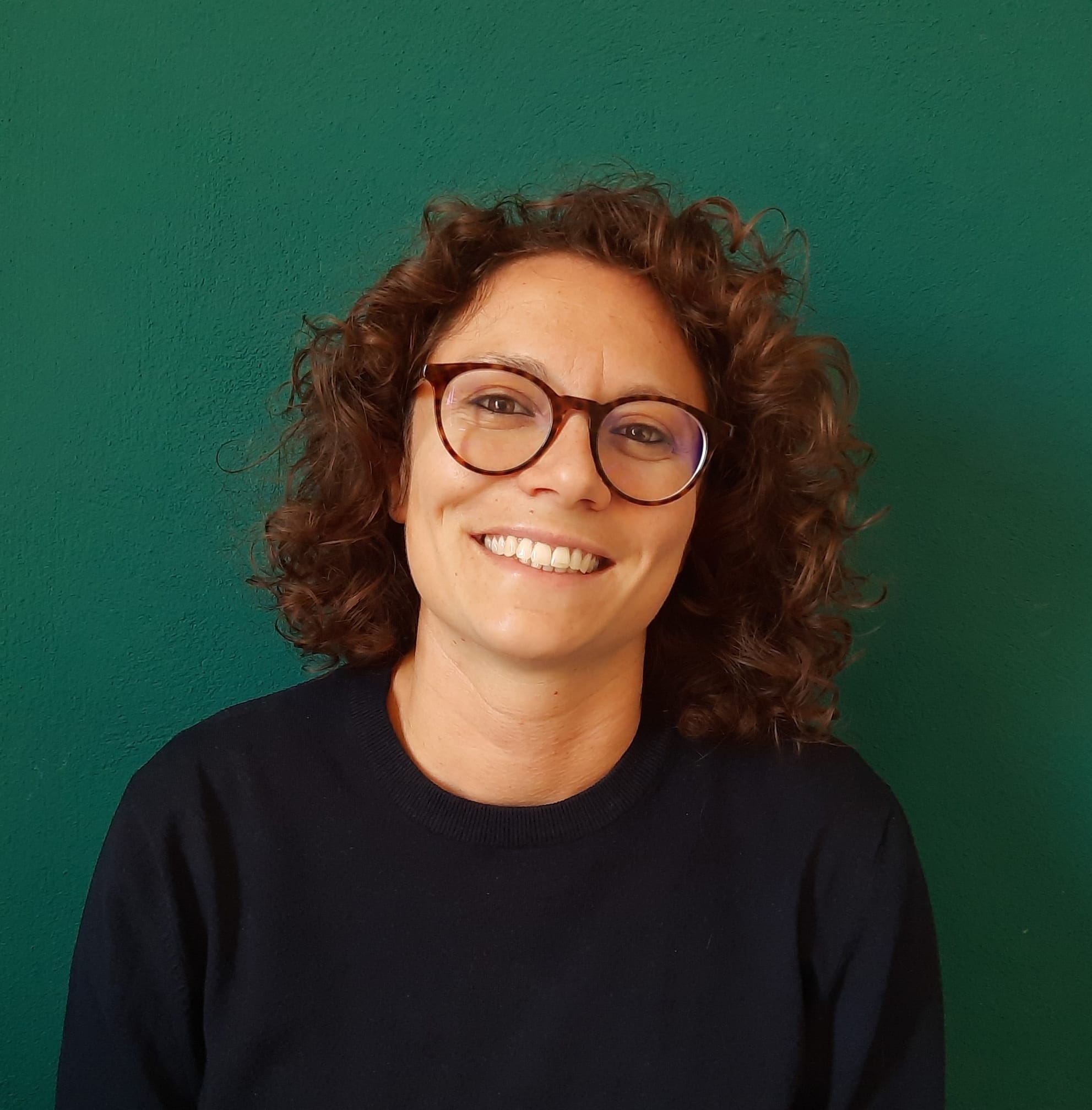 Image of Dr Marta Meschini on a green background